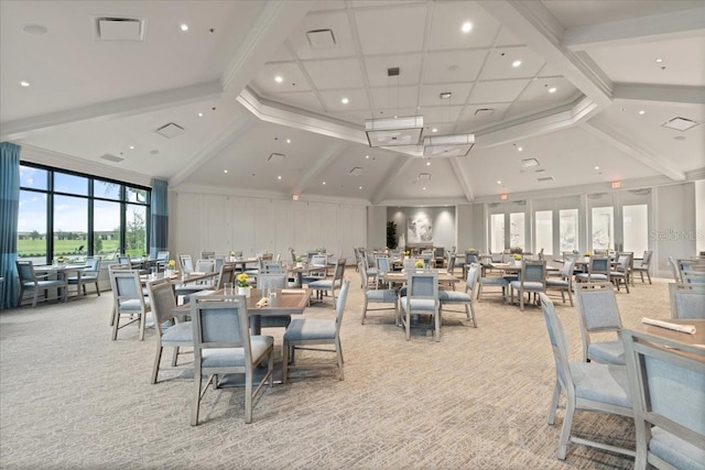 dining space featuring light carpet, high vaulted ceiling, and beamed ceiling