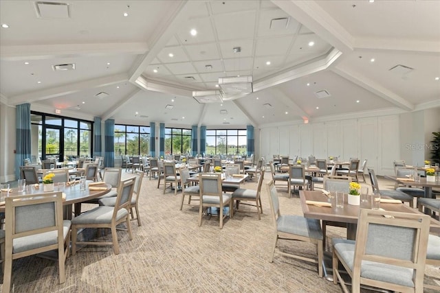 dining space featuring light carpet, high vaulted ceiling, and beamed ceiling