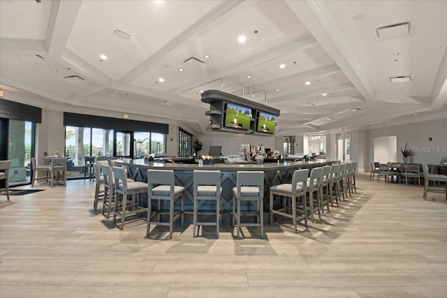 bar with light hardwood / wood-style flooring, beam ceiling, and coffered ceiling