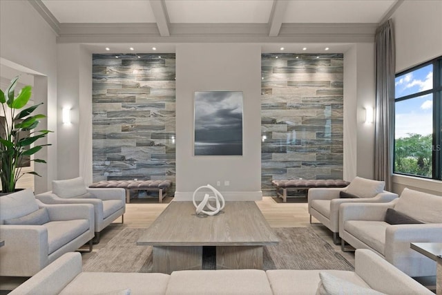 living room with beamed ceiling and light wood-type flooring