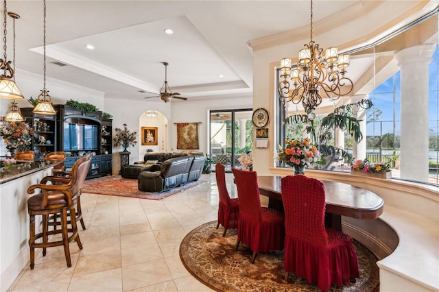 dining area with visible vents, a raised ceiling, ceiling fan with notable chandelier, crown molding, and recessed lighting