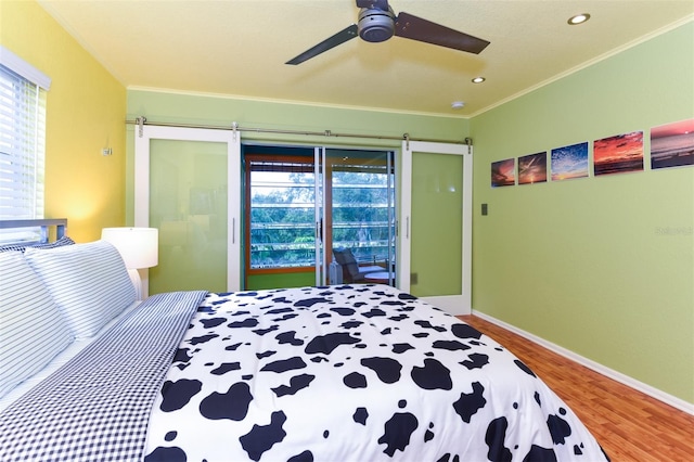 bedroom featuring ornamental molding, access to outside, hardwood / wood-style floors, and ceiling fan