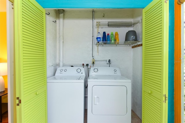 clothes washing area featuring separate washer and dryer