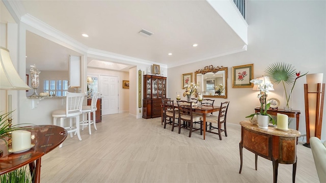 dining area featuring baseboards, visible vents, crown molding, and recessed lighting