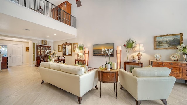 tiled living room featuring a high ceiling