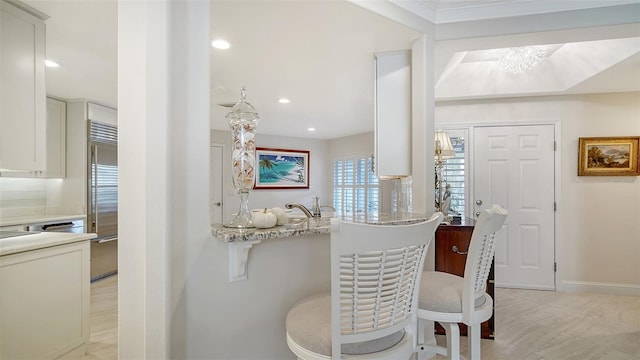 dining area with a chandelier, recessed lighting, and baseboards
