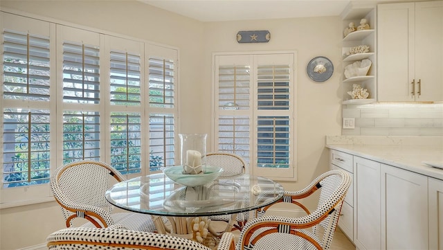 dining space with baseboards
