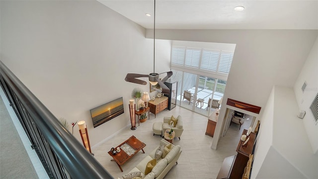 living room with high vaulted ceiling and ceiling fan