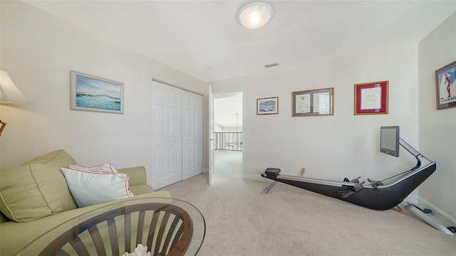 workout room with visible vents, carpet floors, and baseboards