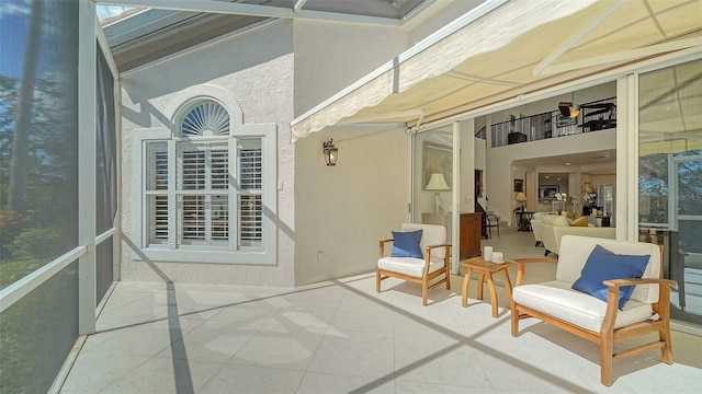 sunroom featuring vaulted ceiling