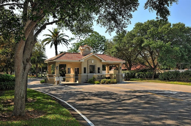 view of front of property with stucco siding and a tiled roof