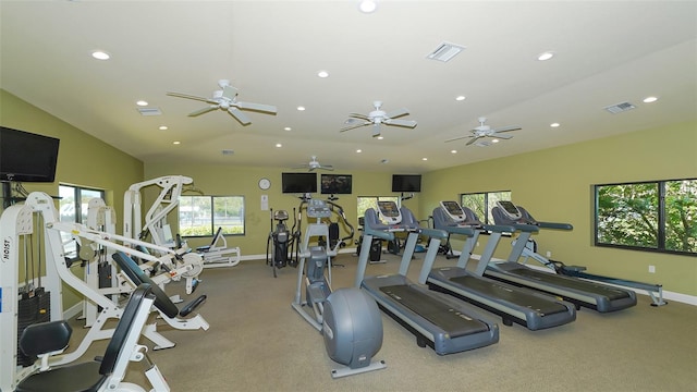 workout area featuring recessed lighting, visible vents, and a wealth of natural light