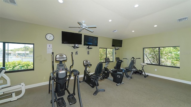 workout area with ceiling fan, carpet flooring, and plenty of natural light