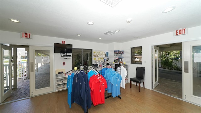 interior space with visible vents, wood finished floors, recessed lighting, and plenty of natural light