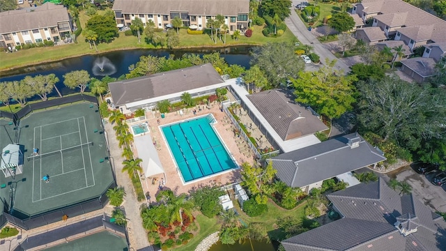 birds eye view of property with a water view