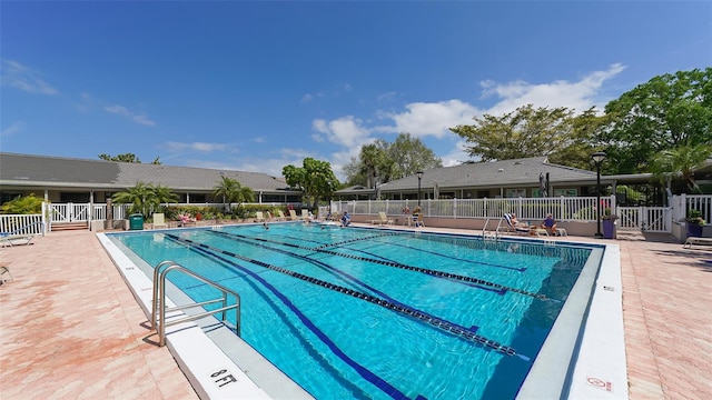 view of swimming pool featuring a patio area