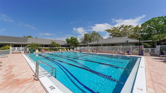 community pool featuring fence