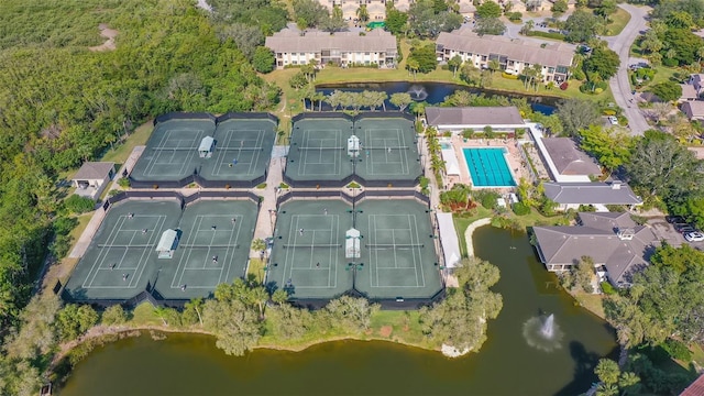 drone / aerial view with a residential view and a water view
