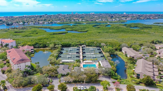 bird's eye view with a residential view and a water view