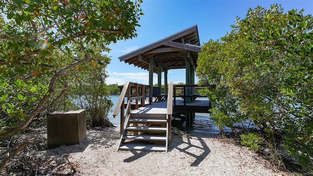 view of dock featuring a gazebo and a water view