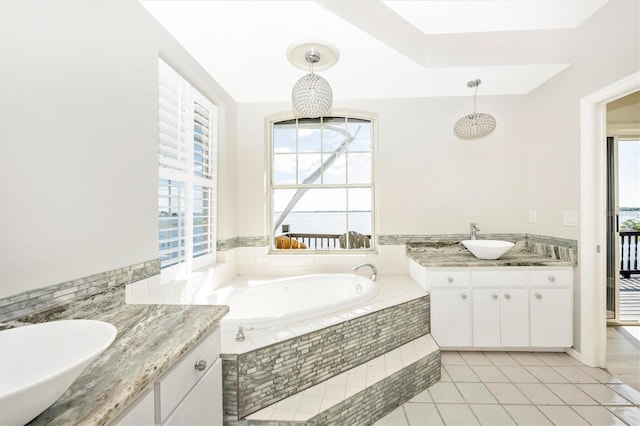 bathroom featuring tile patterned floors, a wealth of natural light, and vanity