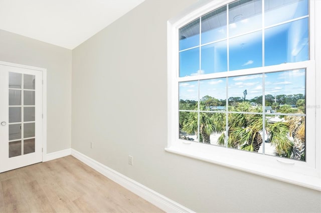 spare room with light hardwood / wood-style floors