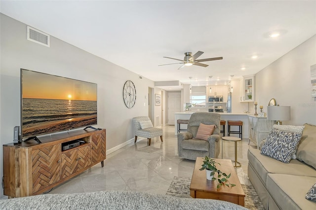 living room featuring ceiling fan