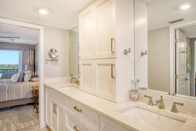 bathroom featuring vanity and ceiling fan