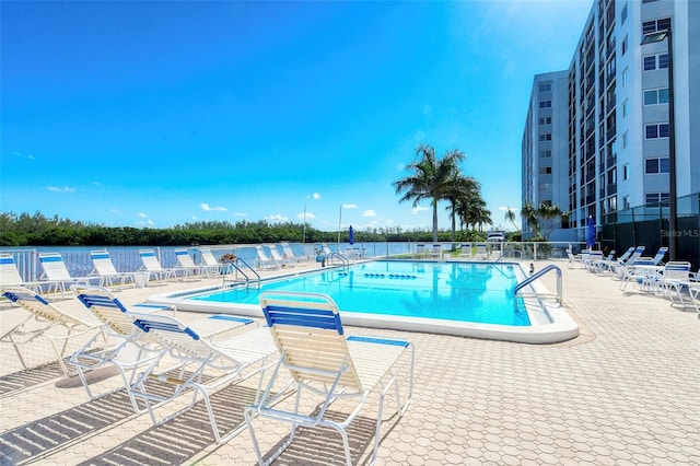 view of swimming pool with a patio area