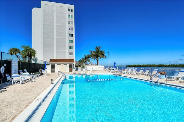 view of pool featuring a patio area and an outdoor structure