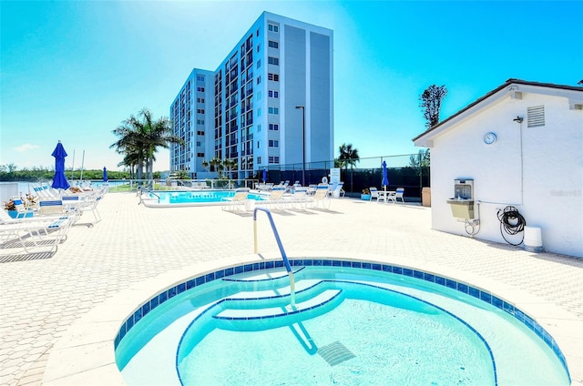 view of swimming pool featuring a patio area