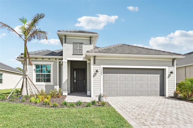 view of front facade featuring a front lawn and a garage