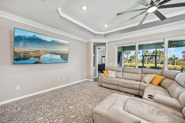 carpeted living room featuring crown molding and ceiling fan