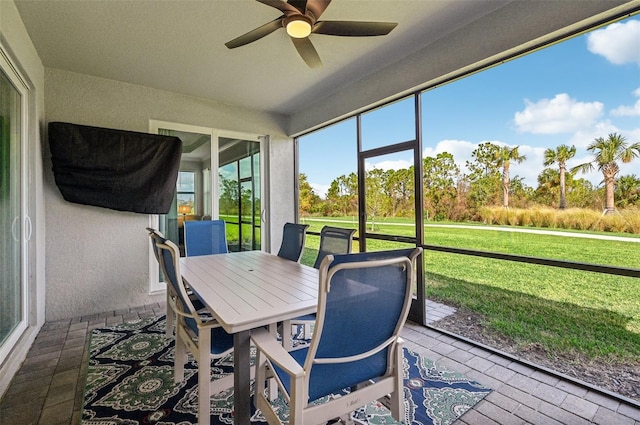 sunroom / solarium with ceiling fan