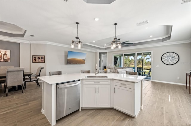 kitchen featuring white cabinetry, dishwasher, sink, and a raised ceiling