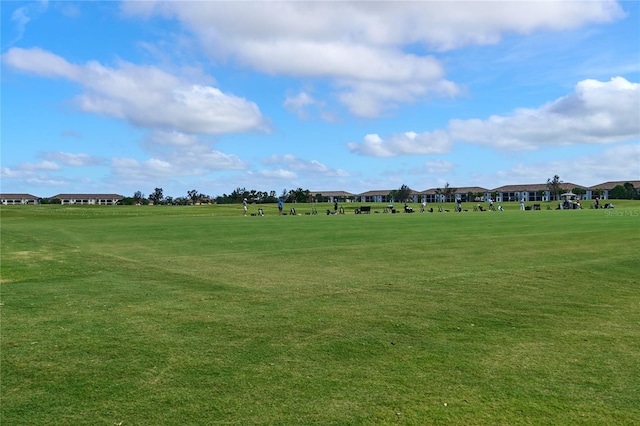 view of home's community with a lawn