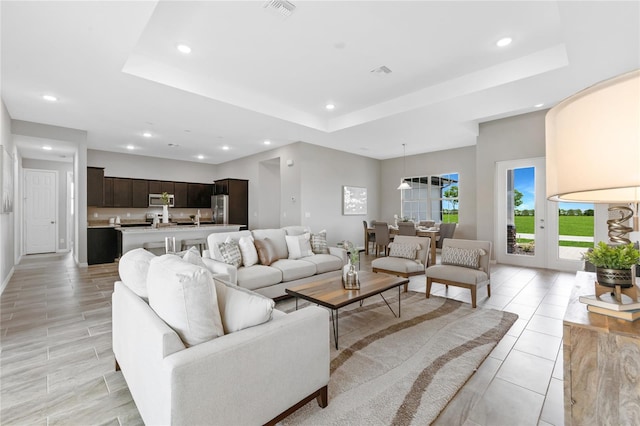 living room with a raised ceiling