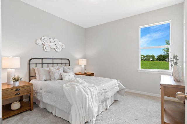 bedroom with light colored carpet