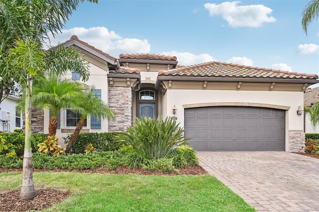 mediterranean / spanish-style house featuring a garage