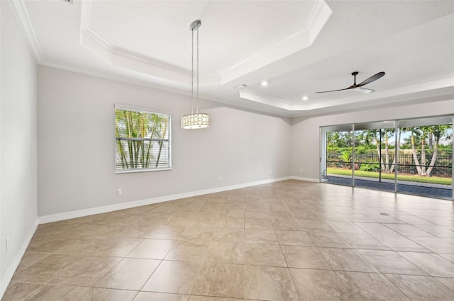 unfurnished room with crown molding, ceiling fan, and a raised ceiling