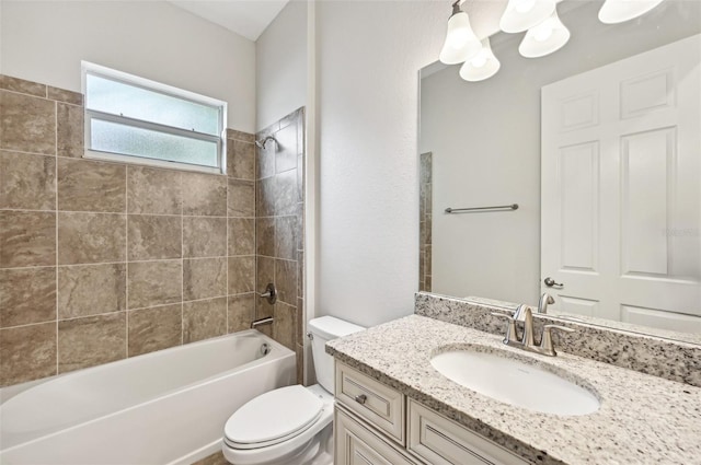 full bathroom featuring vanity, toilet, and tiled shower / bath combo