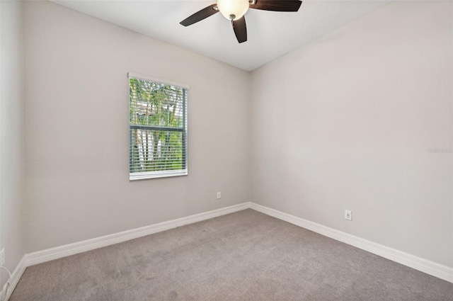 carpeted empty room with ceiling fan