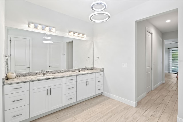 bathroom featuring vanity and hardwood / wood-style floors