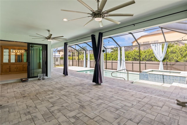 view of pool featuring an in ground hot tub, ceiling fan, a lanai, and a patio