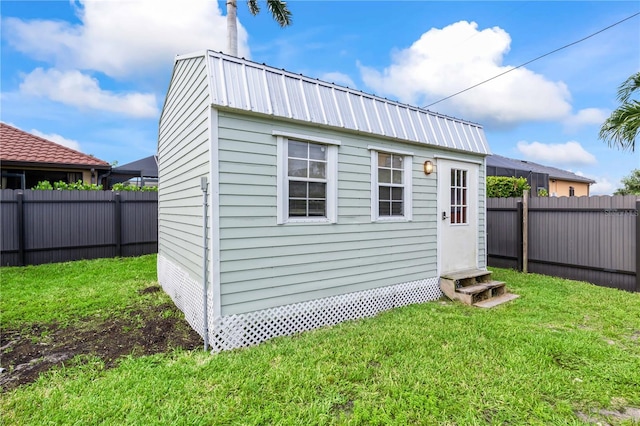 view of outdoor structure with a lawn