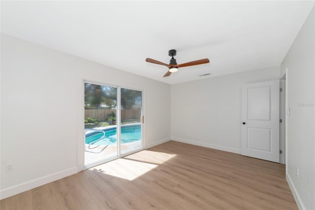 unfurnished room featuring light hardwood / wood-style floors and ceiling fan