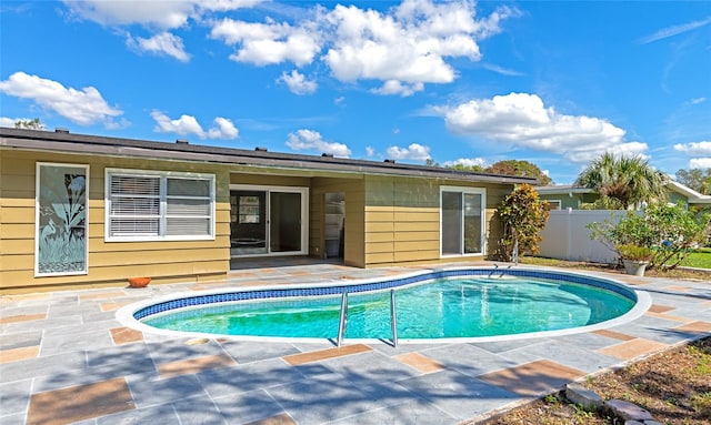 view of swimming pool featuring a patio area