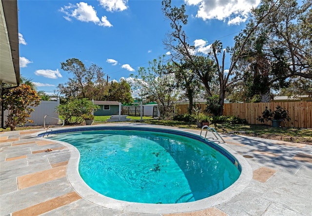 view of swimming pool with a patio area