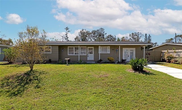 single story home featuring a front lawn