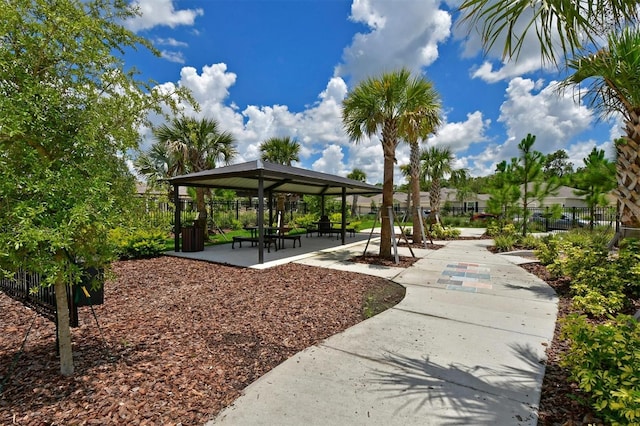 view of property's community featuring a patio area and a gazebo